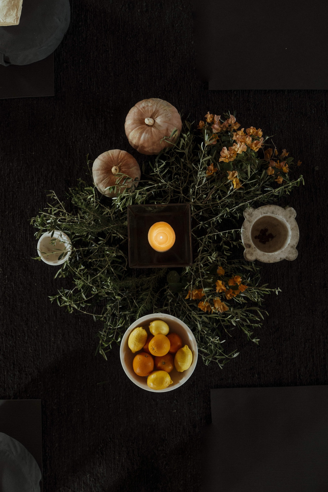 Table styling with candlelight, citrus, and flowers at the retreat